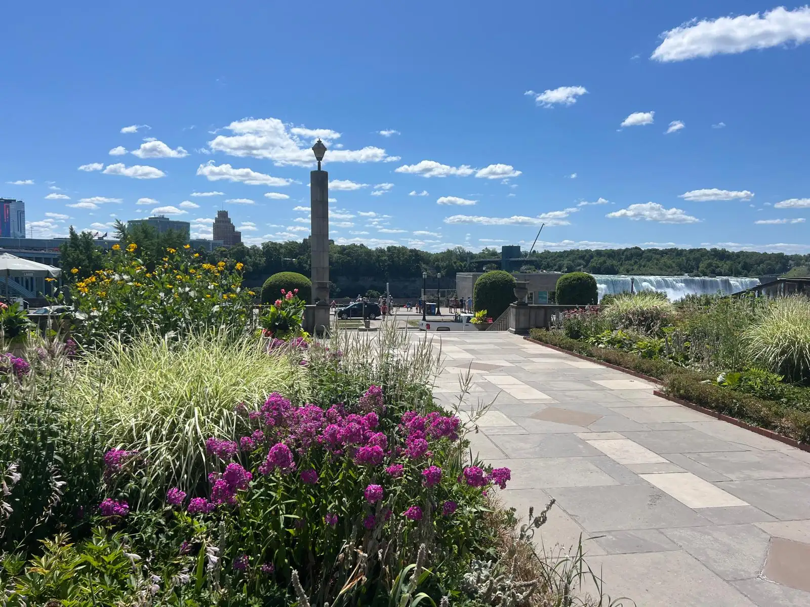 Niagara Parks garden with colourful flowers and falls in background